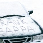 Name written in snow on car hood